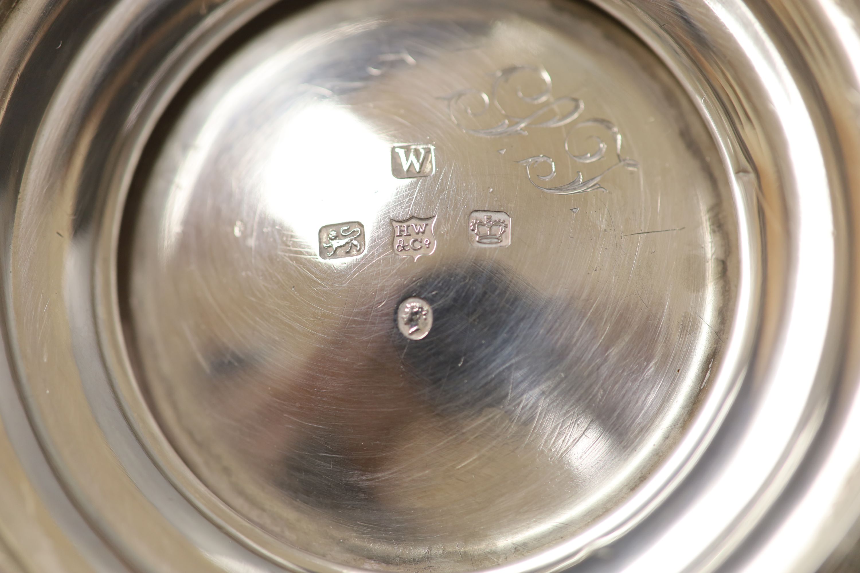 A large Georgian silver teapot, marks rubbed, with an associated twin handled sugar basin, Sheffield, 1864 by Henry Wilkinson & Co